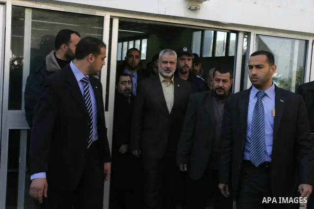 Palestinian Prime Minister in Gaza Strip, Ismail Haniya, arrived to the Rafah border crossing in the southern Gaza Strip on Dec 25, 2011. Haniya will go in foreign tour to participate in an international conference for J...