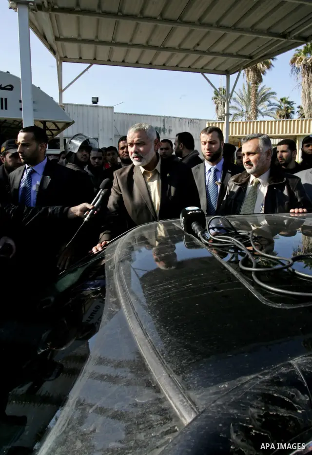 Palestinian Prime Minister in Gaza Strip, Ismail Haniya, arrived to the Rafah border crossing in the southern Gaza Strip on Dec 25, 2011. Haniya will go in foreign tour to participate in an international conference for J...
