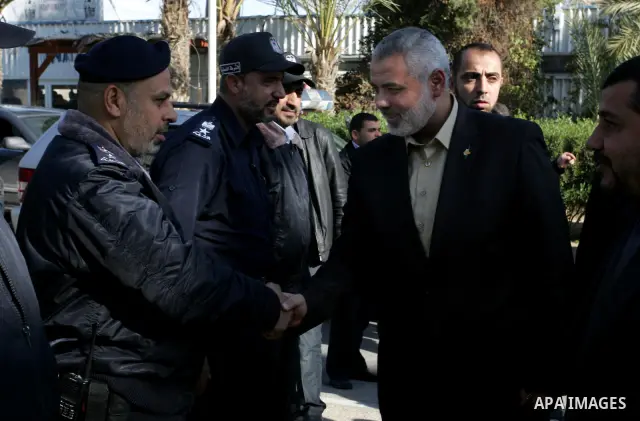 Palestinian Prime Minister in Gaza Strip, Ismail Haniya, arrived to the Rafah border crossing in the southern Gaza Strip on Dec 25, 2011. Haniya will go in foreign tour to participate in an international conference for J...