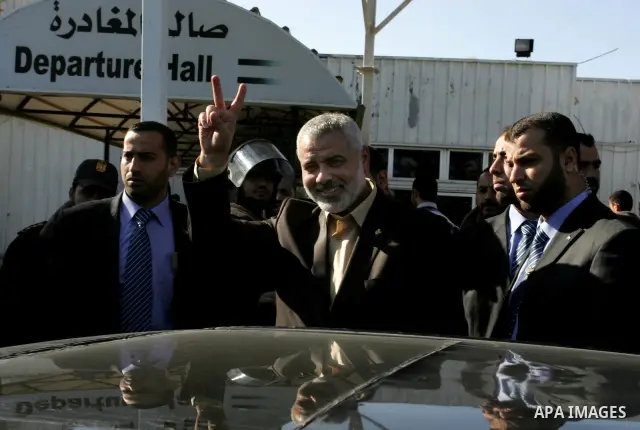Palestinian Prime Minister in Gaza Strip, Ismail Haniya, arrived to the Rafah border crossing in the southern Gaza Strip on Dec 25, 2011. Haniya will go in foreign tour to participate in an international conference for J...