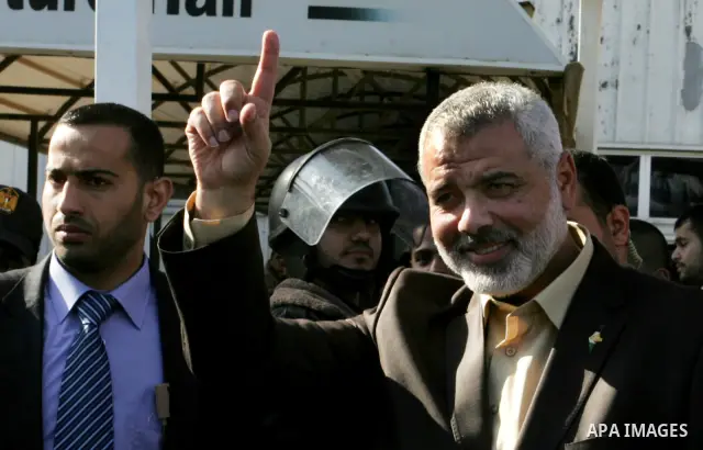 Palestinian Prime Minister in Gaza Strip, Ismail Haniya, arrived to the Rafah border crossing in the southern Gaza Strip on Dec 25, 2011. Haniya will go in foreign tour to participate in an international conference for J...