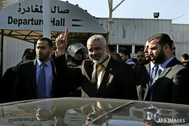 Palestinian Prime Minister in Gaza Strip, Ismail Haniya, arrived to the Rafah border crossing in the southern Gaza Strip on Dec 25, 2011. Haniya will go in foreign tour to participate in an international conference for J...