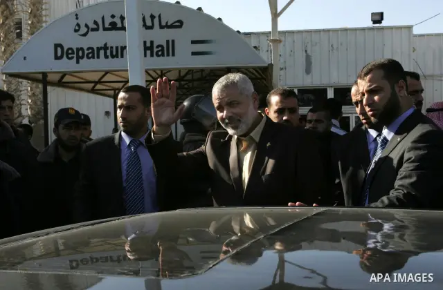 Palestinian Prime Minister in Gaza Strip, Ismail Haniya, arrived to the Rafah border crossing in the southern Gaza Strip on Dec 25, 2011. Haniya will go in foreign tour to participate in an international conference for J...