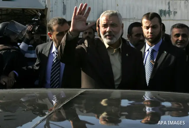 Palestinian Prime Minister in Gaza Strip, Ismail Haniya, arrived to the Rafah border crossing in the southern Gaza Strip on Dec 25, 2011. Haniya will go in foreign tour to participate in an international conference for J...