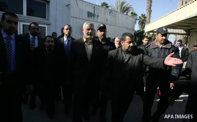 Palestinian Prime Minister in Gaza Strip, Ismail Haniya, arrived to the Rafah border crossing in the southern Gaza Strip on Dec 25, 2011. Haniya will go in foreign tour to participate in an international conference for J...
