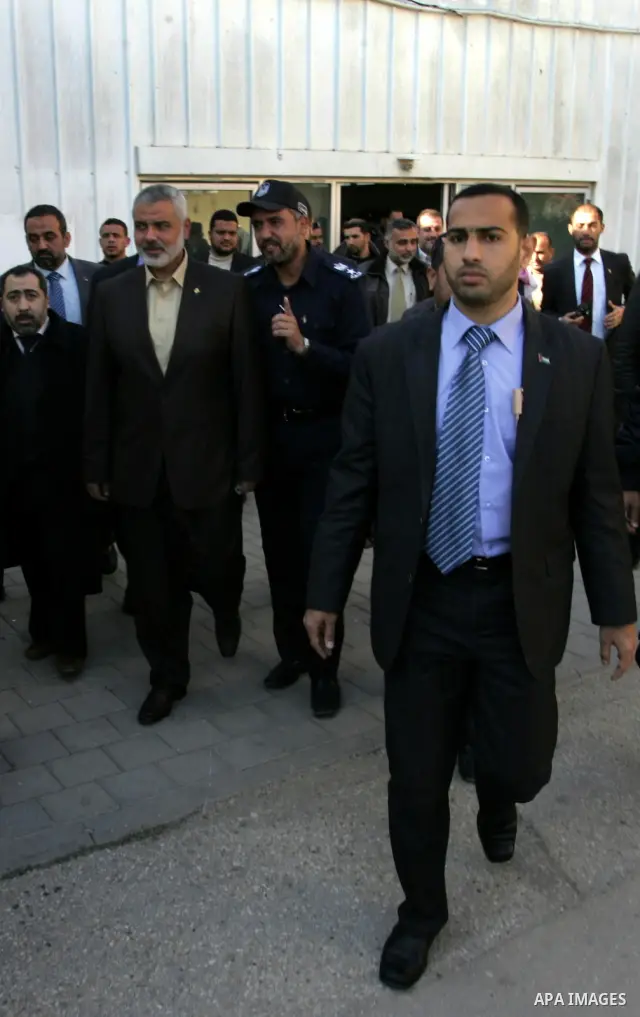 Palestinian Prime Minister in Gaza Strip, Ismail Haniya, arrived to the Rafah border crossing in the southern Gaza Strip on Dec 25, 2011. Haniya will go in foreign tour to participate in an international conference for J...