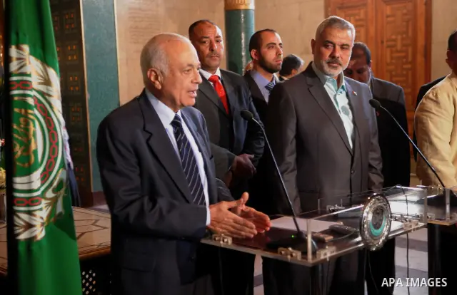 Arab league Secretary General, Nabil el-Arabi, left, meets with Gaza's Hamas Prime Minister, Ismail Haniyeh in Cairo, Egypt, Monday, Dec. 26, 2011. Photo by MOHAMMED AL-OSTAZ .