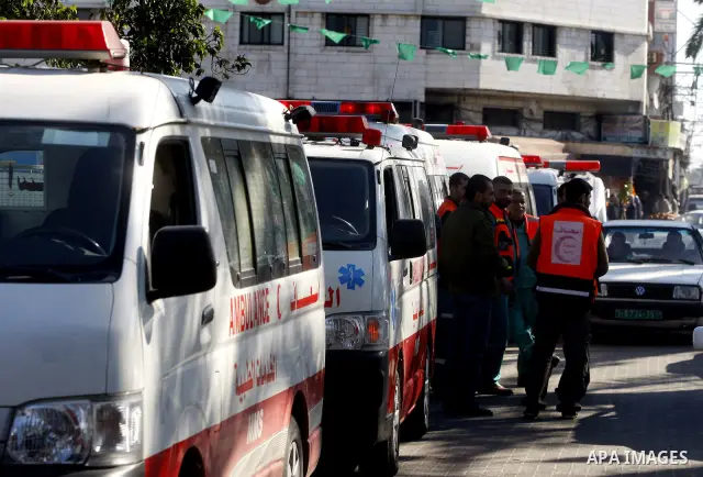 Members of the Palestinian civil defence during thier tour in the third anniversary of the Israeli war on the Gaza Strip in Gaza city on Dec. 27,2011. Photo by Mahmud Nassar