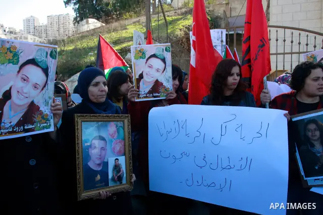 Palestinians participate in a demonstration in solidarity with prisoners jailed in Israel, in the West Bank city of Nablus, Wednesday ,Dec. 28, 2011. Photo by Wagdi Eshtayah.