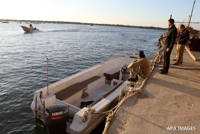 Israeli ships destruction the Oliva boat, in the coast of Gaza City on Dec. 28, 2011. Photo by Mohammed Asad