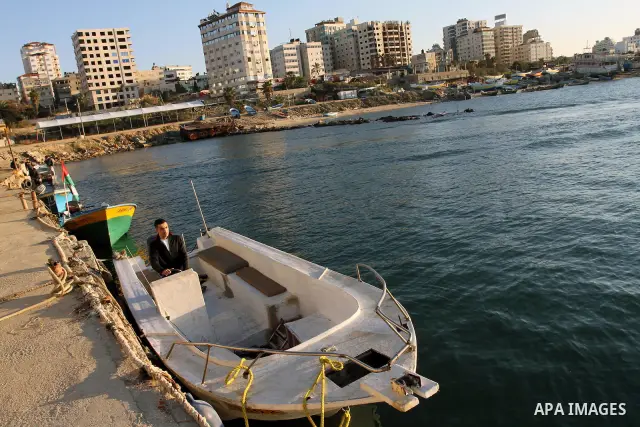 Israeli ships destruction the Oliva boat, in the coast of Gaza City on Dec. 28, 2011. Photo by Mohammed Asad
