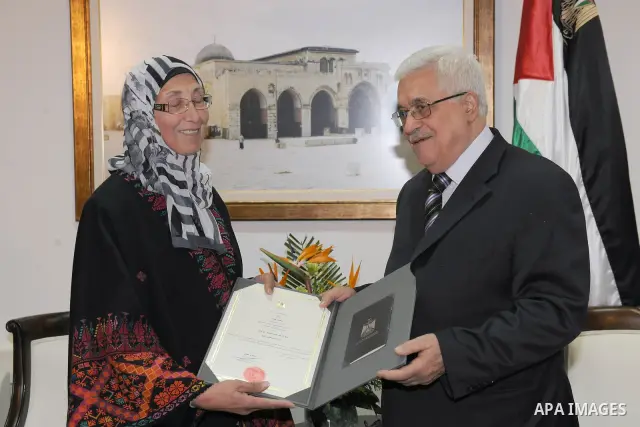 Palestinian President, Mahmoud Abbas (Abu Mazen), granted the Order of Merit and excellence of the late former President of the Teachers Union. Jamil Shehadeh, in the West Bank city of Ramallah on Dec 27, 2011. Thaer Gha...