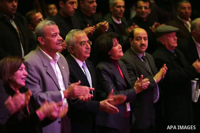 Palestinian Prime Minister, Salam Fayyad, attends at the opening of the second Palestine Festival of creativity for people with disabilities, in the West Bank city of Ramallah, on Dec. 28, 2011. Photo by Mustafa Abu Daye...