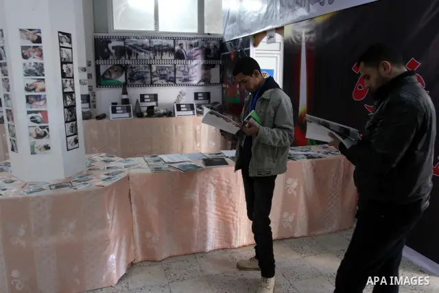 Palestinians, take parts during the opening of gallery of the palestinian police Contains Israeli equipment, in Gaza City, on Dec. 29, 2011. Photo by Mohammed Asad