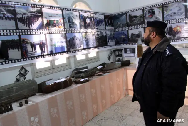 Palestinian member of Hamas, take parts during the opening of gallery of the palestinian police Contains Israeli equipment, in Gaza City, on Dec. 29, 2011. Photo by Mohammed Asad