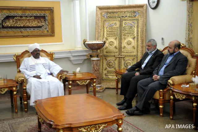 Sudanese President Omar al-Beshir meets with Palestinian Prime Minister in gaza, Ismail Haniyeh, and Hamas politburo chief, Khaled Meshaal in the Sudan's capital of Al-Khartoum on December 28, 2011. Photo by Mohamad Osta...