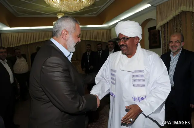 Sudanese President Omar al-Beshir meets with Palestinian Prime Minister in gaza, Ismail Haniyeh, and Hamas politburo chief, Khaled Meshaal in the Sudan's capital of Al-Khartoum on December 28, 2011. Photo by Mohamad Osta...