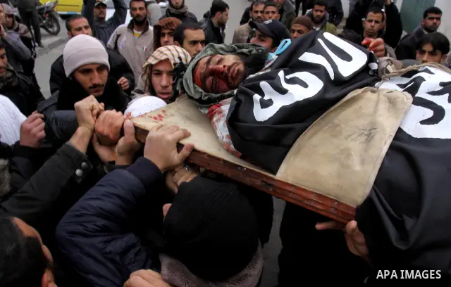 Palestinians carry the body of militant Momen Abu Daf during his funeral in Gaza City December 30, 2011. Israel killed the leader of an al Qaeda-inspired faction in the Gaza Strip on Friday, accusing him of involvement i...