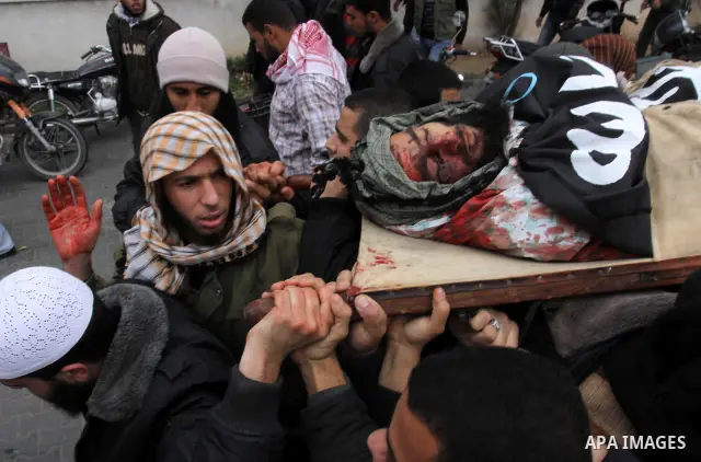 Palestinians carry the body of militant Momen Abu Daf during his funeral in Gaza City December 30, 2011. Israel killed the leader of an al Qaeda-inspired faction in the Gaza Strip on Friday, accusing him of involvement i...