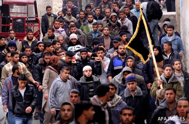 Palestinians carry the body of militant Momen Abu Daf during his funeral in Gaza City December 30, 2011. Israel killed the leader of an al Qaeda-inspired faction in the Gaza Strip on Friday, accusing him of involvement i...