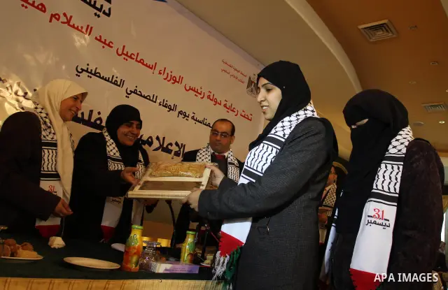 Palestinian government Information Office, honoring women journalists during a ceremony in Gaza City on Dec 31,2011. Photo by Mohammed Asad