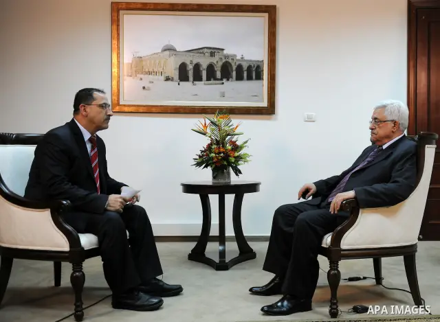 Palestinian President Mahmoud Abbas, speaks in an interview to Palestine TV, during mark the 47th anniversary of Palestinian revolution and the establishing of Fatah movement, in the West Bank city of Ramallah on Decembe...