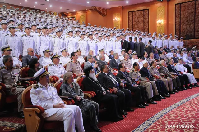 In this image released by the Egyptian Presidency, Egyptian President, Mohammed Morsi at a graduation ceremony at the Police Academy headquarters in Cairo, Egypt, July 14, 2012. The Police Academy was also the venue for...