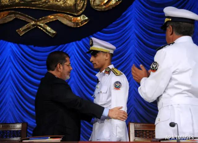 In this image released by the Egyptian Presidency, Egyptian President, Mohammed Morsi at a graduation ceremony at the Police Academy headquarters in Cairo, Egypt, July 14, 2012. The Police Academy was also the venue for...