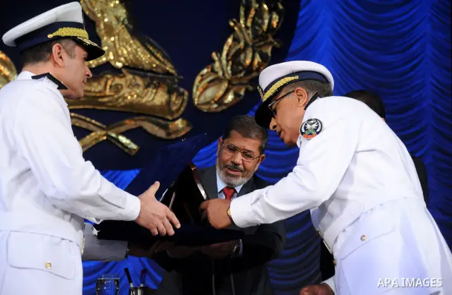 In this image released by the Egyptian Presidency, Egyptian President, Mohammed Morsi at a graduation ceremony at the Police Academy headquarters in Cairo, Egypt, July 14, 2012. The Police Academy was also the venue for...