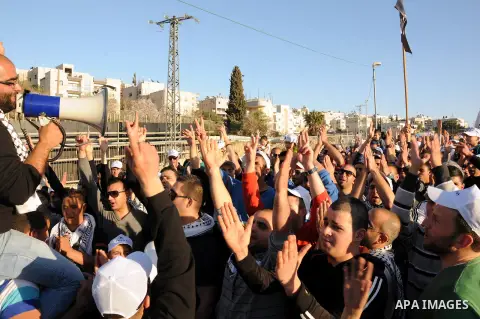 Palestinians take part in a protest against the opening project of the street number (4) in the middle of Bet Safafa neighbourhood, which is for settlement project services, in Jerusalem on February 26, 2013. Photo by Ma...