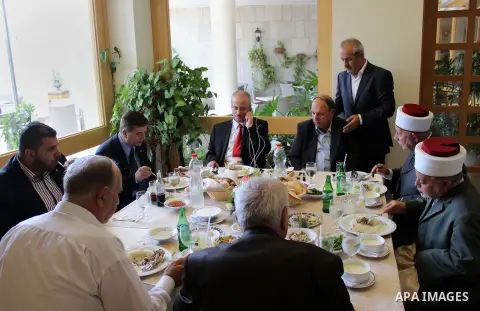 Newly appointed Palestinian Prime Minister Rami Hamdallah, talks on the phone at a hotel during his visit to Jerusalem, June 16, 2013. Hamdallah said the PA is trying to build support for Jerusalem in Arab and internatio...
