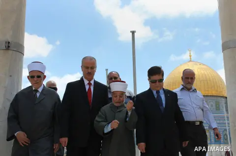 Newly appointed Palestinian Prime Minister Rami Hamdallah, visits the Dome of the Rock shrine in Jerusalem Sunday, June 16, 2013. Hamdallah said the PA is trying to build support for Jerusalem in Arab and international c...