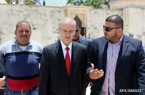 Newly appointed Palestinian Prime Minister Rami Hamdallah visits the Al-Makassed Islamic Charitable Society Hospital, in Jerusalem, June 16, 2013. Hamdallah said the PA is trying to build support for Jerusalem in Arab an...