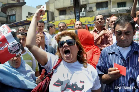 Egyptian protesters shout anti-President Mohammed Morsi slogans during a protest in Tahrir Square, the focal point of Egyptian uprising, in Cairo, Egypt, Friday, June 28, 2013. Elsewhere, thousands of supporters of Egypt...