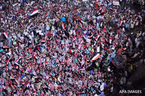 Fireworks light the sky as opponents of Egypt's Islamist President Mohammed Morsi protest in Tahrir square, in Cairo, Egypt, Tuesday, July 2, 2013. With the clock ticking, Egypt's besieged president said Tuesday that he...