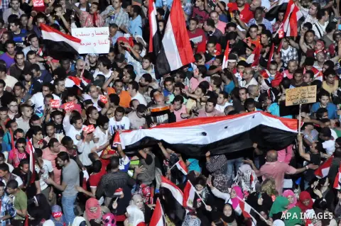 Fireworks light the sky as opponents of Egypt's Islamist President Mohammed Morsi protest in Tahrir square, in Cairo, Egypt, Tuesday, July 2, 2013. With the clock ticking, Egypt's besieged president said Tuesday that he...