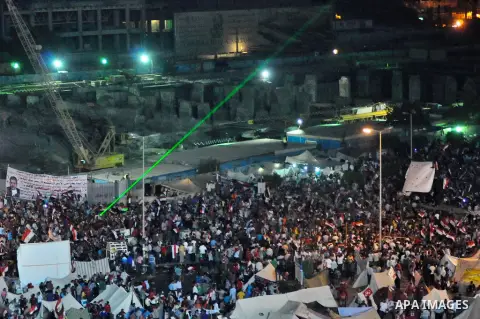 Fireworks light the sky as opponents of Egypt's Islamist President Mohammed Morsi protest in Tahrir square, in Cairo, Egypt, Tuesday, July 2, 2013. With the clock ticking, Egypt's besieged president said Tuesday that he...