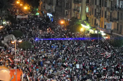 Fireworks light the sky as opponents of Egypt's Islamist President Mohammed Morsi protest in Tahrir square, in Cairo, Egypt, Tuesday, July 2, 2013. With the clock ticking, Egypt's besieged president said Tuesday that he...