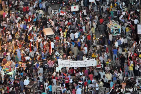 Fireworks light the sky as opponents of Egypt's Islamist President Mohammed Morsi protest in Tahrir square, in Cairo, Egypt, Tuesday, July 2, 2013. With the clock ticking, Egypt's besieged president said Tuesday that he...