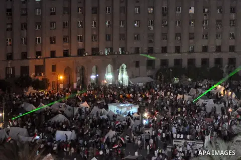 Fireworks light the sky as opponents of Egypt's Islamist President Mohammed Morsi protest in Tahrir square, in Cairo, Egypt, Tuesday, July 2, 2013. With the clock ticking, Egypt's besieged president said Tuesday that he...