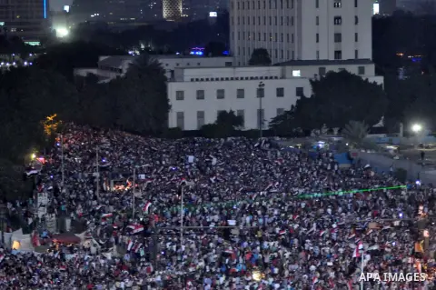 Fireworks light the sky as opponents of Egypt's Islamist President Mohammed Morsi protest in Tahrir square, in Cairo, Egypt, Tuesday, July 2, 2013. With the clock ticking, Egypt's besieged president said Tuesday that he...