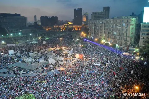 Fireworks light the sky as opponents of Egypt's Islamist President Mohammed Morsi protest in Tahrir square, in Cairo, Egypt, Tuesday, July 2, 2013. With the clock ticking, Egypt's besieged president said Tuesday that he...