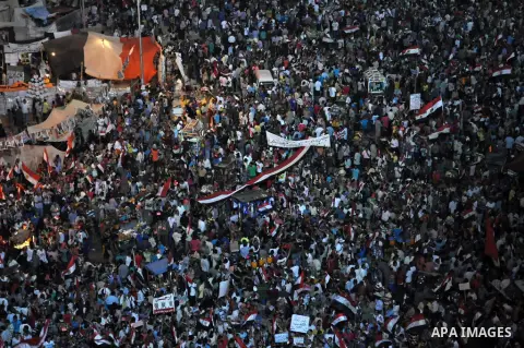 Fireworks light the sky as opponents of Egypt's Islamist President Mohammed Morsi protest in Tahrir square, in Cairo, Egypt, Tuesday, July 2, 2013. With the clock ticking, Egypt's besieged president said Tuesday that he...