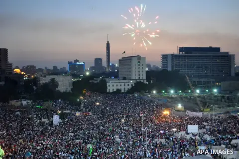 Fireworks light the sky as opponents of Egypt's Islamist President Mohammed Morsi protest in Tahrir square, in Cairo, Egypt, Tuesday, July 2, 2013. With the clock ticking, Egypt's besieged president said Tuesday that he...