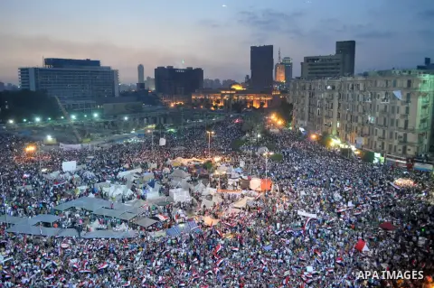 Fireworks light the sky as opponents of Egypt's Islamist President Mohammed Morsi protest in Tahrir square, in Cairo, Egypt, Tuesday, July 2, 2013. With the clock ticking, Egypt's besieged president said Tuesday that he...