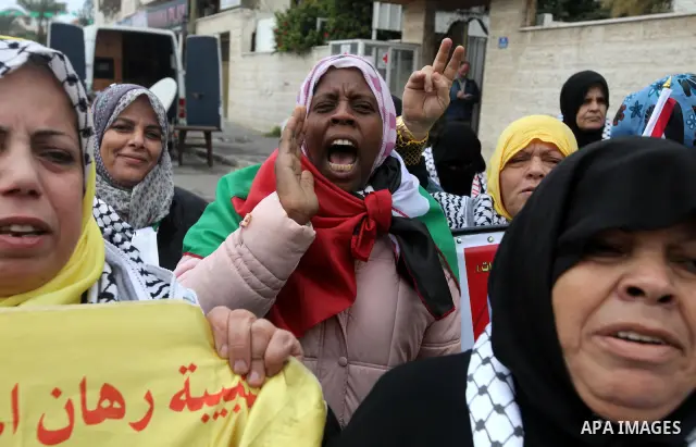 Palestinians women hold pictures of their prison relatives in Israeli jails as they gather in a weekly activity calling for their liberty at the Red Cross headquarters in Gaza City on Jan 02, 2012. About 7000 prisoners a...