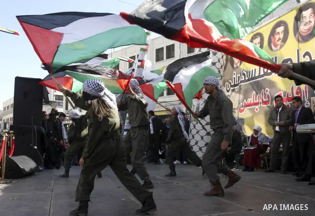 Palestinians celebrate the 47th anniversary of the establishment of the Fatah party, in the West Bank city of Nablus on January 5, 2012. Photo by Wagdi Eshtayah