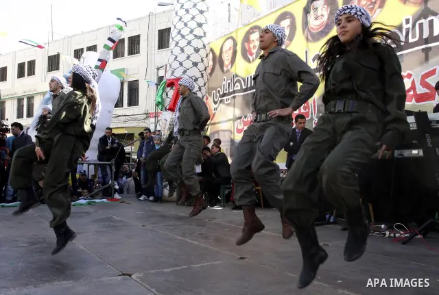 Palestinians celebrate the 47th anniversary of the establishment of the Fatah party, in the West Bank city of Nablus on January 5, 2012. Photo by Wagdi Eshtayah