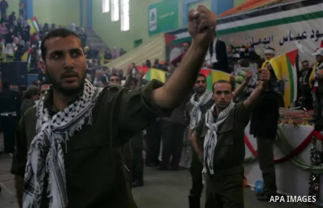 Palestinians celebrate during a mass wedding organized by the Fatah movement for around 40 released Palestinian prisoners in Rafah refugee camp in the southern Gaza Strip on January 5, 2012.Photo by Abed Rahim Khatib