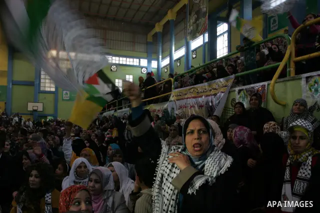 Palestinians celebrate during a mass wedding organized by the Fatah movement for around 40 released Palestinian prisoners in Rafah refugee camp in the southern Gaza Strip on January 5, 2012. Photo by Abed Rahim Khatib